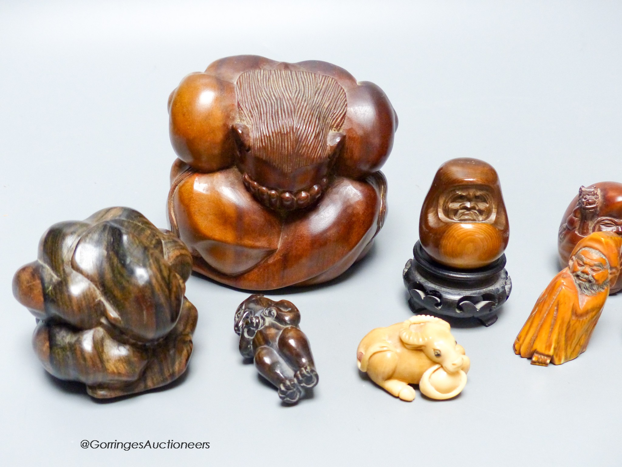 A collection of netsuke, and other carvings, tallest 10cm